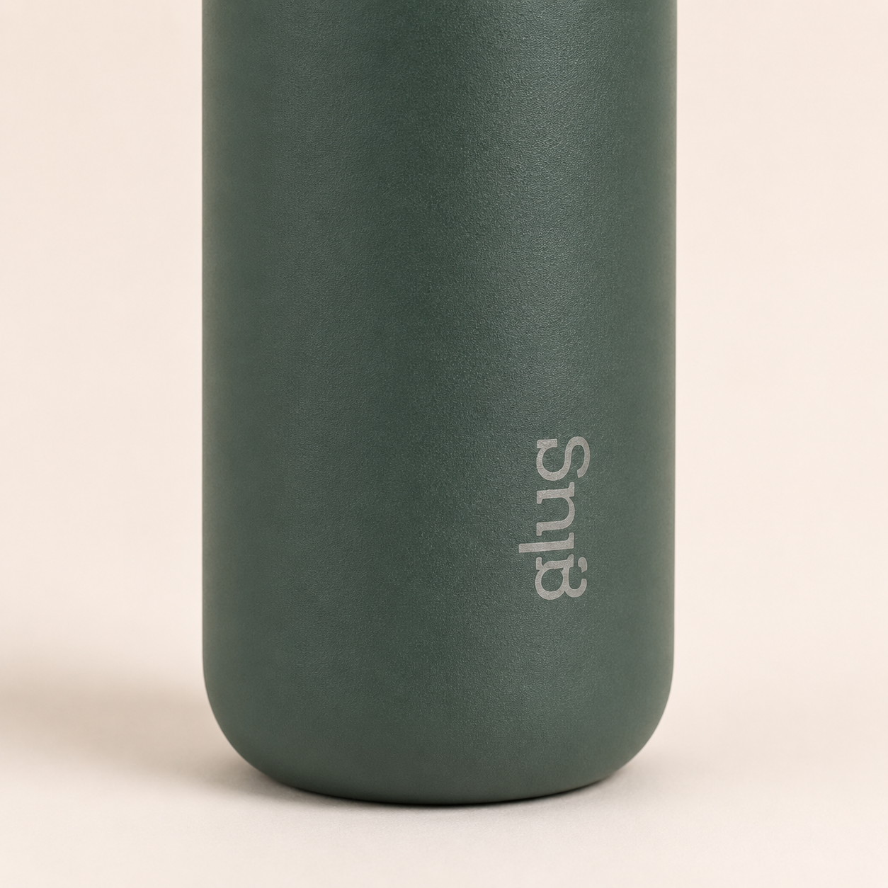 Close-up of glug bottle base and body — matte powder-coat texture with glug logo